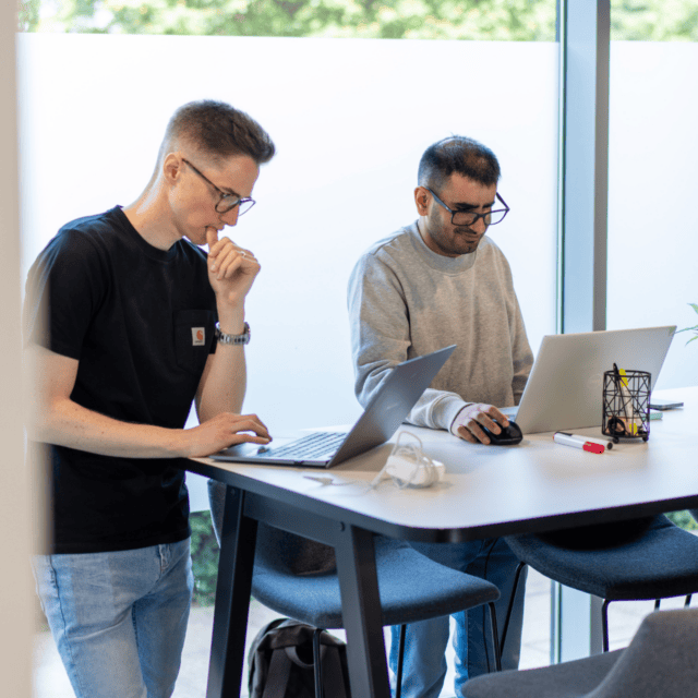 Harj and James working in c3 office